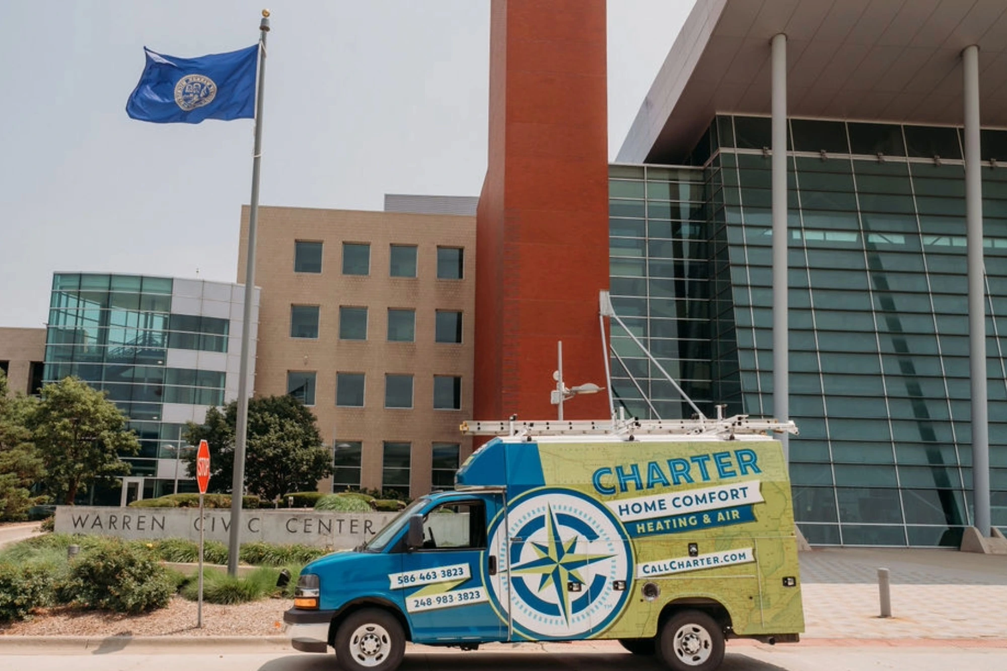 Charter Home Comfort service van parked in front of the warren Civic center in Warren, Michigan